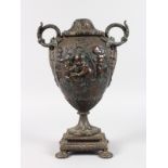 A 19TH CENTURY BRONZE TWO HANDLED URN SHAPED VASE, lacking finial. 1ft 2ins high.
