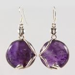 A PAIR OF SILVER AND AMETHYST EARRINGS.