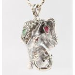 A SILVER ELEPHANT NECKLACE set with rubies, emeralds and sapphires.