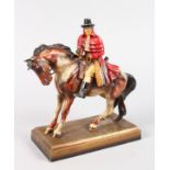 AN AUSTRIAN PAINTED METAL AMUSING NOVELTY LIGHTER, a highwayman on a horse. 9ins high.