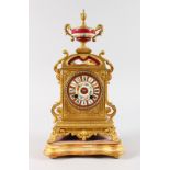 A LOUIS XVI GILT METAL CLOCK with painted porcelain Sevres type panels, with eight-day movement,