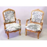 A PAIR OF FRENCH GILDED ARMCHAIRS with crush velvet backs, seats and arms.