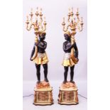 A LARGE PAIR OF BLACKAMOOR STANDING CANDELABRA, each holding a gilt cornucopia with five scrolling