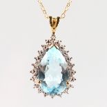A 9CT GOLD BLUE TOPAZ AND DIAMOND PENDANT NECKLACE.