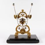 A GOOD GRASSHOPPER BRASS SKELETON CLOCK in a glass case. 19ins high overall.