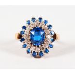 A 14CT YELLOW GOLD, TANZANITE AND DIAMOND CLUSTER DRESS RING.