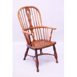 AN OAK AND ELM WINDSOR ARMCHAIR with crinoline stretcher.