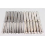 TWO SETS OF SIX SILVER HANDLED TEA KNIVES (12).