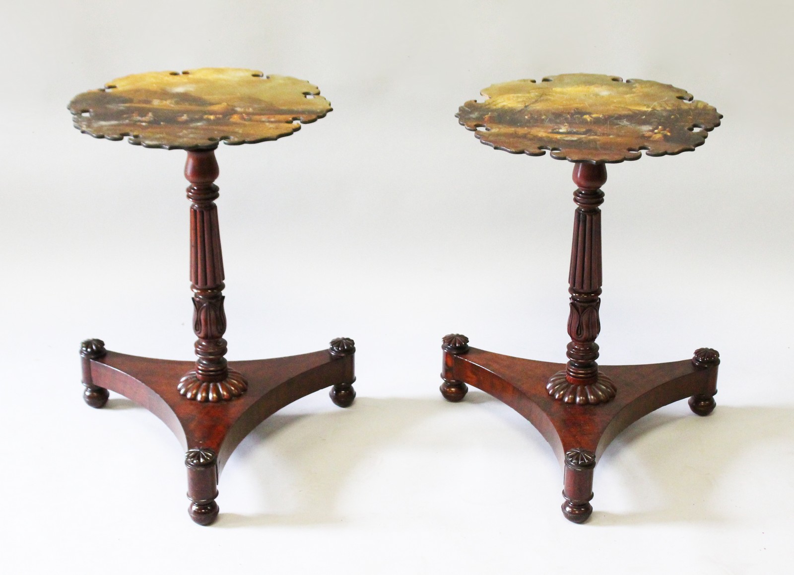 A GOOD PAIR OF VICTORIAN MAHOGANY PAPIER MACHE TOP TABLES painted with rural scenes, supported on