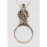 A SILVER NOVELTY SHERLOCK HOLMES SPY GLASS NECKLACE.