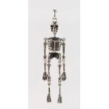A NOVELTY SILVER ARTICULATED SKELETON.