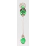 A SUPERB CARTIER OF PARIS APPLE GREEN JADE AND DIAMOND SET JABOT PIN, formed as a Chinese carved