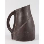 A ROYAL DOULTON BLACK SILICON "LEATHER" JUG. 9ins high.