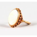 A 9CT YELLOW GOLD OPAL DRESS RING.