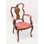 A VICTORIAN ROSEWOOD INLAID ARMCHAIR with unusual shaped back, inlaid splat, padded seat,