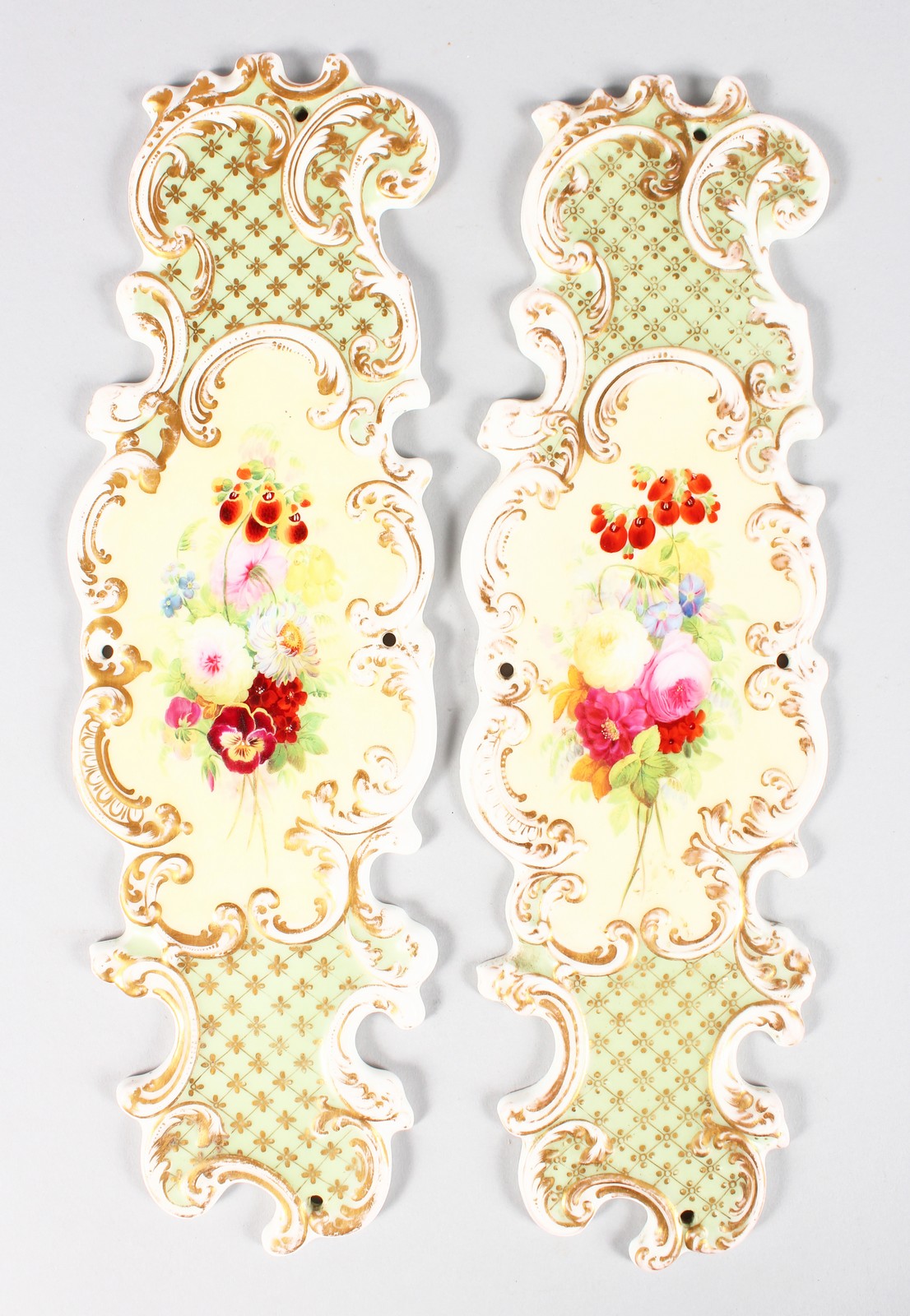 A PAIR OF COPELAND & GARRETT PORCELAIN DOOR PANELS painted with flowers. 12ins long.