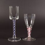 TWO GEORGIAN WINE GLASSES with coloured air twist stems. 6ins and 4.5ins high.