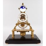 A GOOD MOONFACE BRASS SKELETON CLOCK in a glass case. 19ins high overall.