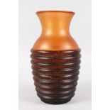 AN ART NOUVEAU RIBBED VASE. 10.5ins high.