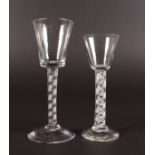 TWO GEORGIAN WINE GLASSES with air twist stems. 6ins and 5.5ins high.