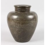 A CHINESE PEWTER GINGER JAR AND COVER. 8.5ins high.