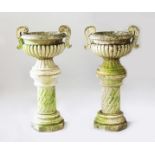 A VERY GOOD PAIR OF CARVED WHITE MARBLE CIRCULAR TWO HANDLED URNS ON STANDS, in the Chinese