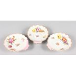 THREE SMALL DRESDEN SHELL DISHES painted with flowers. 5ins.