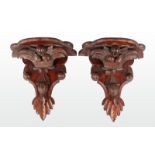 A LARGE PAIR OF CARVED WOOD WALL BRACKETS, leaves and fruit. 1ft 4ins long.