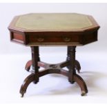 A MAPLE & CO AESTHETIC MAHOGANY OCTAGONAL DRUM TABLE with green leather top, two frieze drawers,