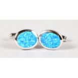 A PAIR OF SILVER AND GILSON OPAL CUFFLINKS.