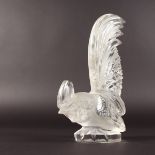 A LALIQUE COCKEREL on a circular base. Etched LALIQUE FRANCE. 8.25ins high.