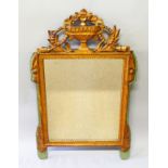 AN ANTIQUE GILDED MIRROR with urn and swag surmount. 3ft 4ins high, 2ft 1ins wide.