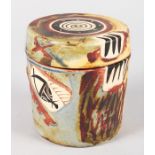 A PICASSO DESIGN CIRCULAR POTTERY BOX AND COVER. 5ins high.