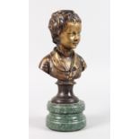 A BRONZE BUST OF A YOUNG BOY, head and shoulders, on a circular marble base. 11ins high.