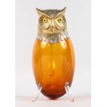 A LARGE CONTINENTAL SILVER MOUNTED OWL CLARET JUG with silver head and glass eyes. 10ins high.