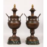 A SUPERB PAIR OF 19TH CENTURY FRENCH BRONZE TWO-HANDLED URNS AND COVERS, on marble bases. 22ins