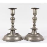 A GOOD PAIR OF PEWTER CANDLESTICKS with large domed bases. 9.5ins high.