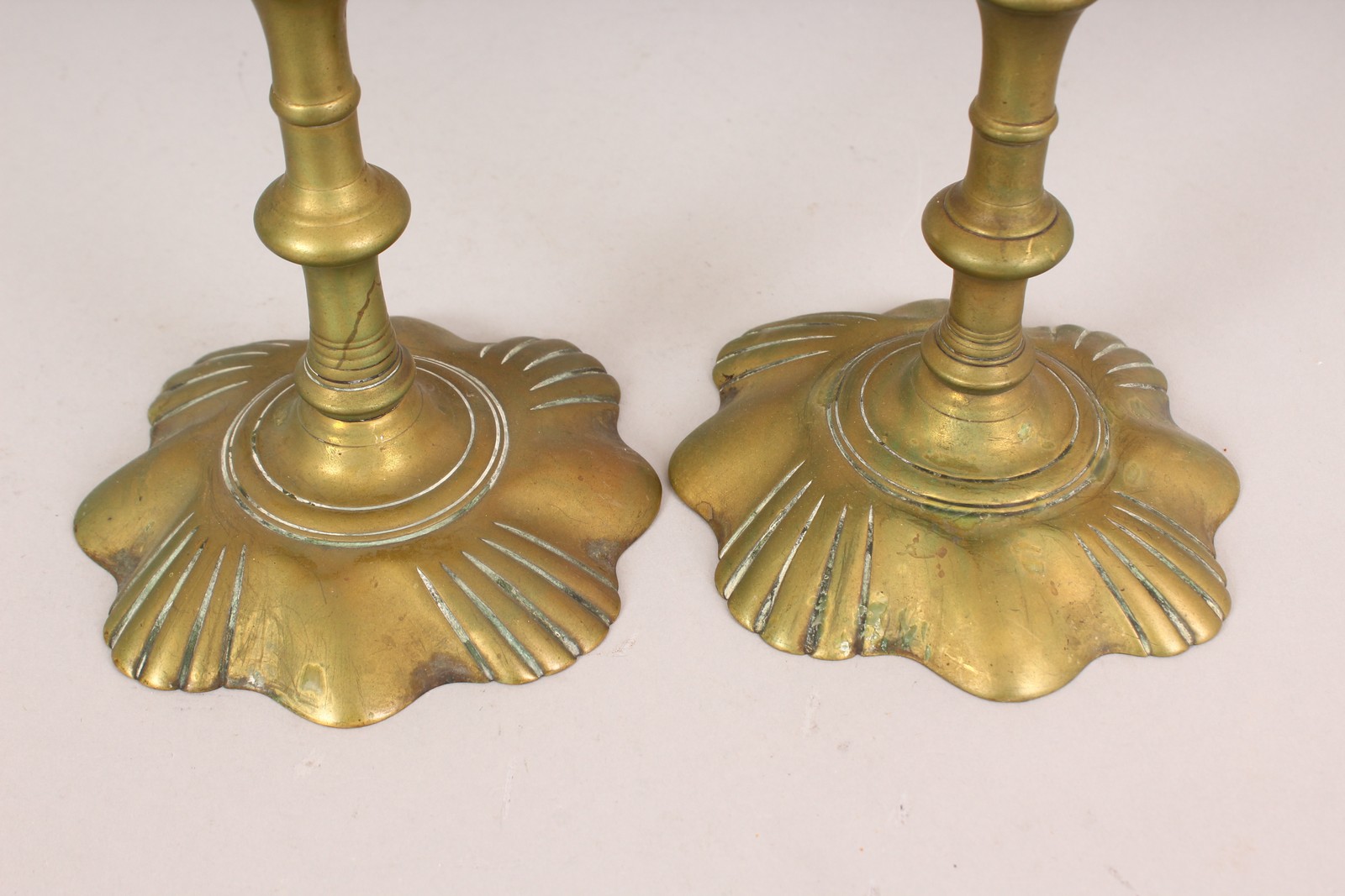 A PAIR OF EARLY PETAL BASE BRASS CANDLESTICKS. 8ins high. - Image 2 of 3