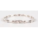 A GOOD 18CT WHITE GOLD SATIN FINISH DIAMOND SET BRACELET.