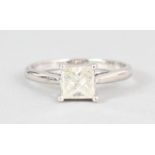 AN 18CT WHITE GOLD PRINCESS CUT SINGLE STONE DIAMOND RING.