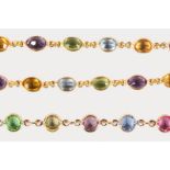 A 9CT YELLOW GOLD NECKLACE AND BRACELET set with semi-precious stones.