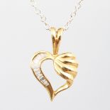 A 14CT YELLOW GOLD DIAMOND SET HEART SHAPED PENDANT AND CHAIN.