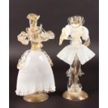 A PAIR OF VENETIAN GLASS FIGURES OF A MAN AND WOMAN. The man missing his head. 11ins high.
