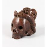 A GOOD BRONZE MINIATURE SKULL, signed Geschutzt.