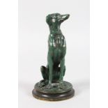 AFTER BARYE (1839-1882) FRENCH A SEATED BRONZE HOUND. Signed BARYE, on a circular base. 6.5ins