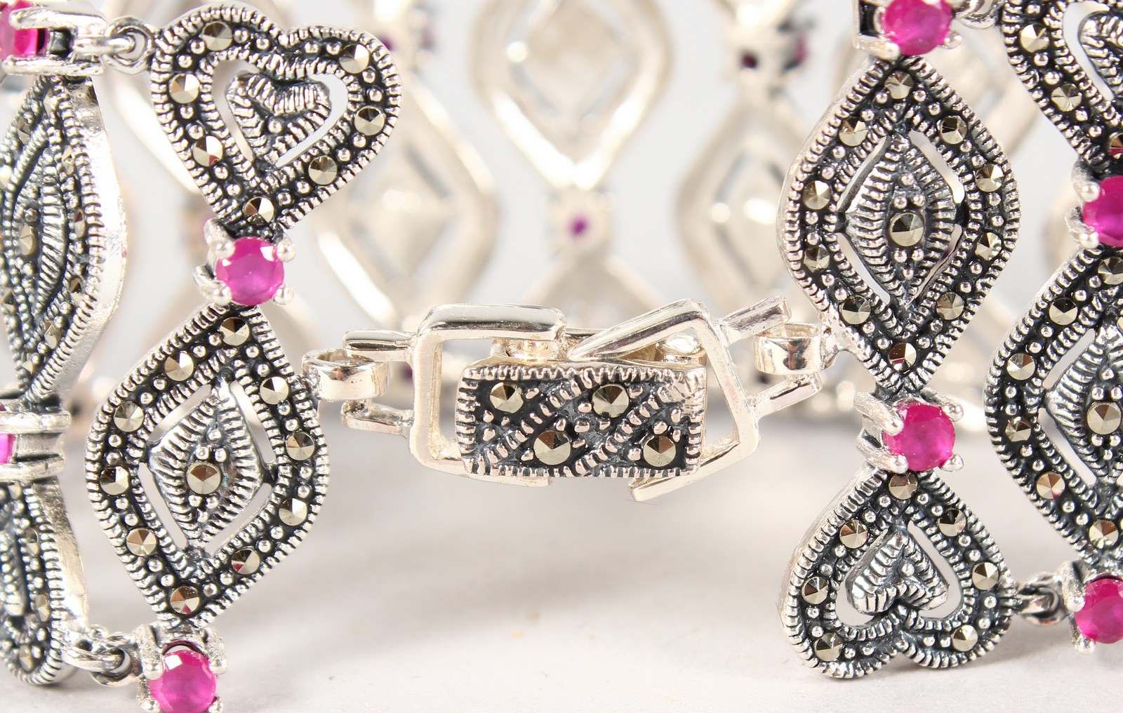 A SILVER, MARCASITE AND RUBY WIDE BRACELET. - Image 2 of 2