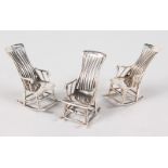 THREE .925 SILVER ROCKING CHAIRS.