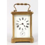 A 19TH CENTURY FRENCH BRASS CARRIAGE CLOCK with alarm and bell. 4.5ins high.