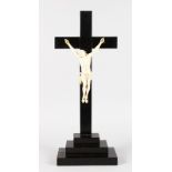 A SUPERB ITALIAN CARVED IVORY CORPUS CHRISTI, Christ 9.5ins long, on a wooden cross 21ins high.