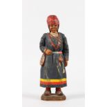 A CARVED AND PAINTED WOODEN FIGURE OF A YOUNG GIRL, POSSIBLY RUSSIAN. 8ins high.